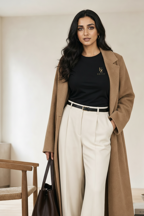 Cream wide-leg trousers lifestyle editorial in minimal luxury interior
