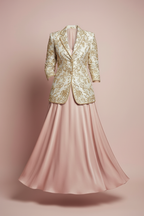 Flat lay product shot of ivory gold blazer and blush satin skirt co-ord set
