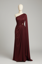 Burgundy draped cape gown displayed on a mannequin