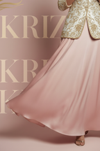 Closeup of blush pink satin flared skirt hem
