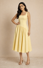 Muze wearing the Kritzy Butter Sculpt drop-waist frock in a bold, confident pose