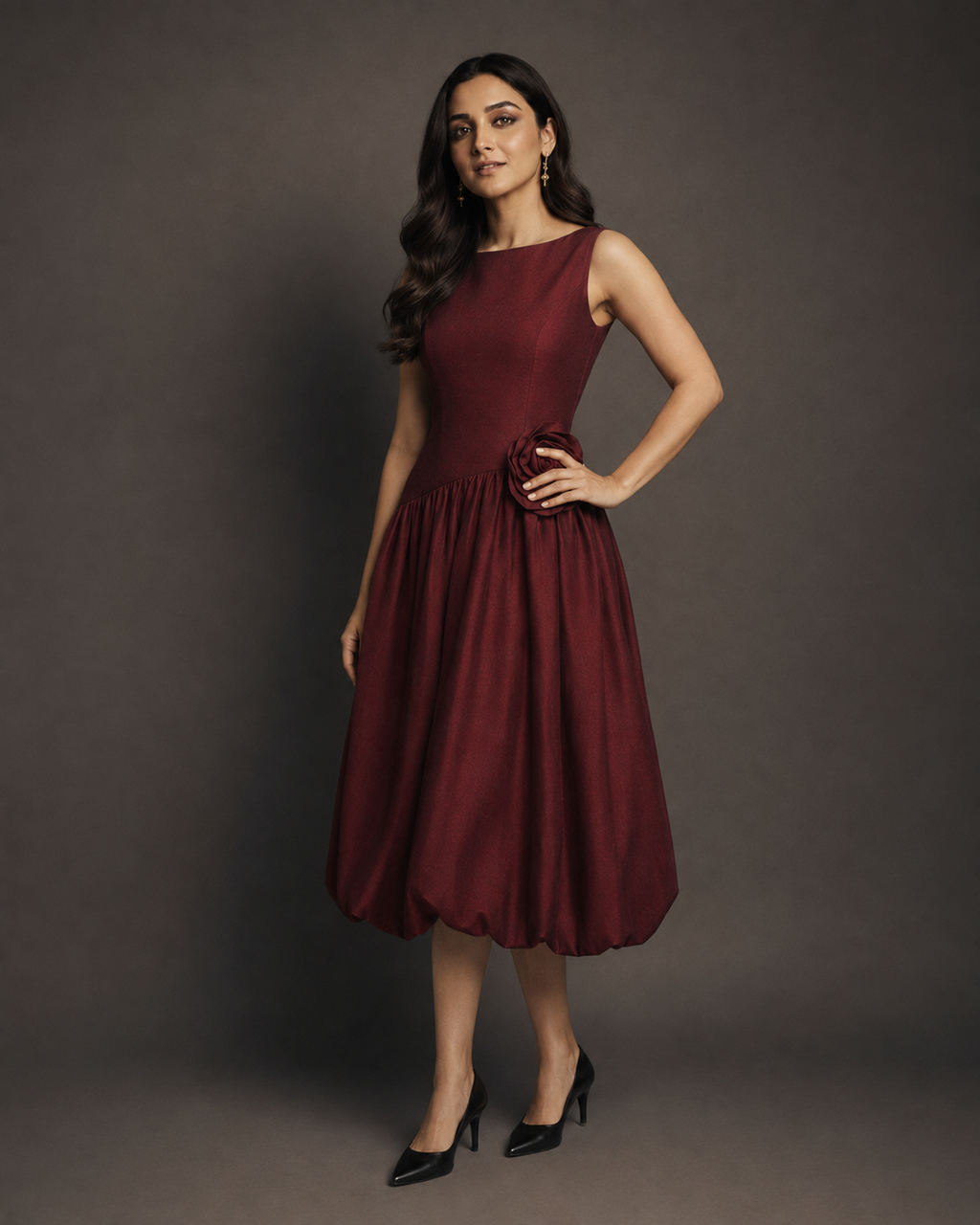 Muze wearing the Kritzy Garnet Bloom occasion frock in a bold, confident pose