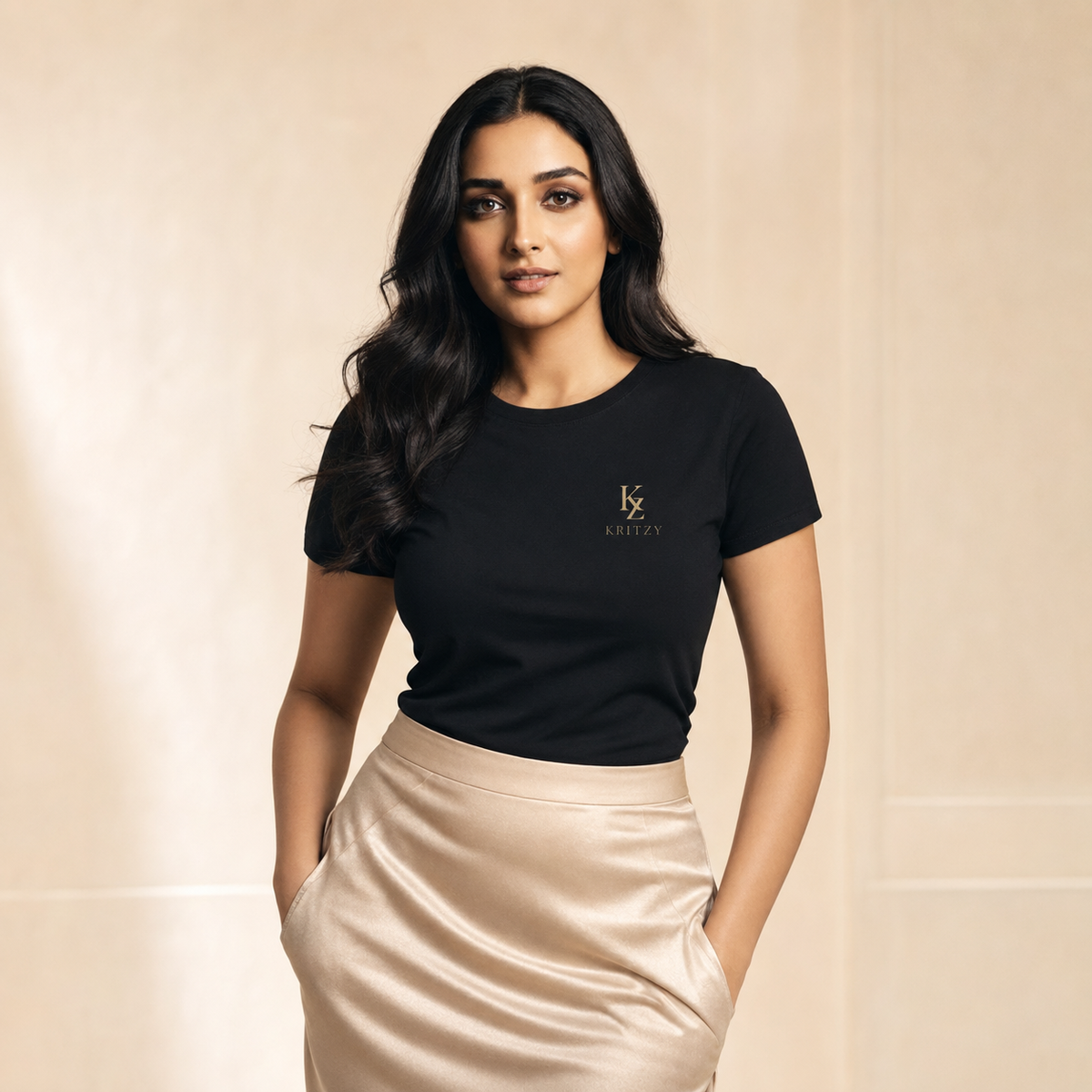 Muze wearing the Kritzy Midnight black fitted T-shirt with gold monogram